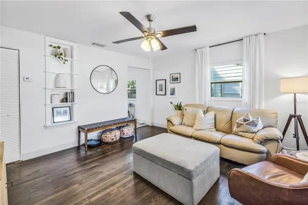 a living room with furniture and a window
