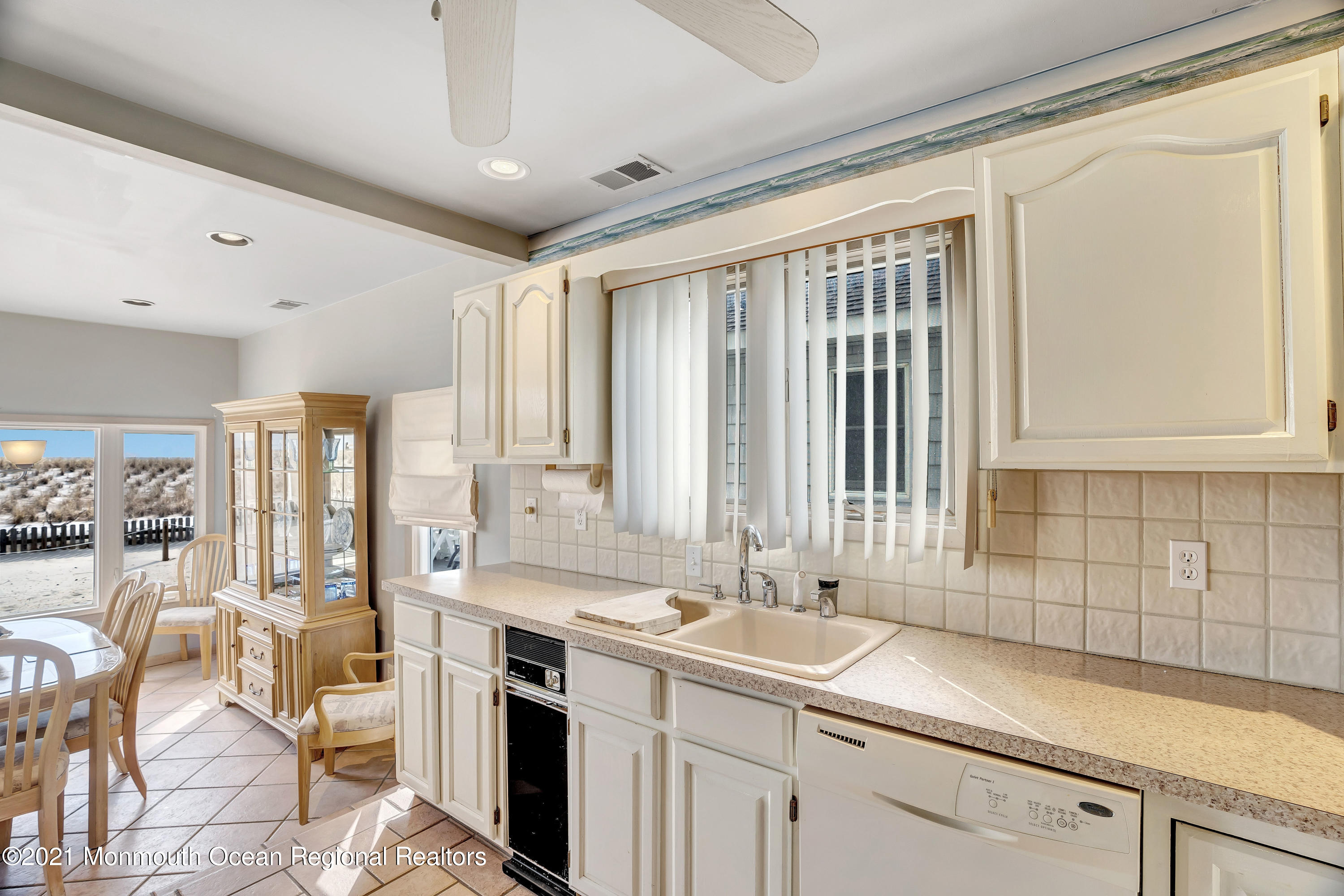 3176 Ocean Road Lavallette, NJ 08735 - Photo 28 of 39 a view of a kitchen counter top space with stainless steel appliances granite countertop a sink and cabinets