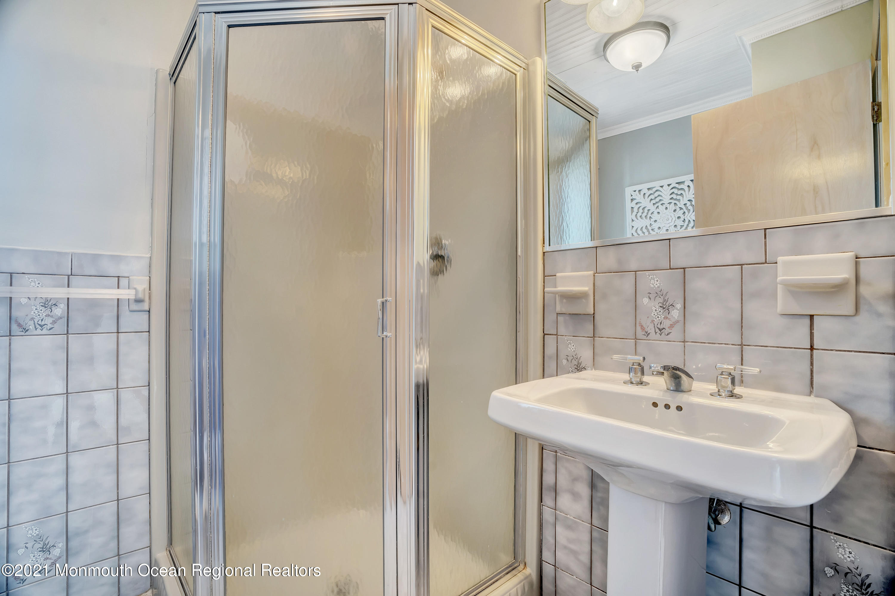 3176 Ocean Road Lavallette, NJ 08735 - Photo 30 of 39 a bathroom with a sink and a mirror