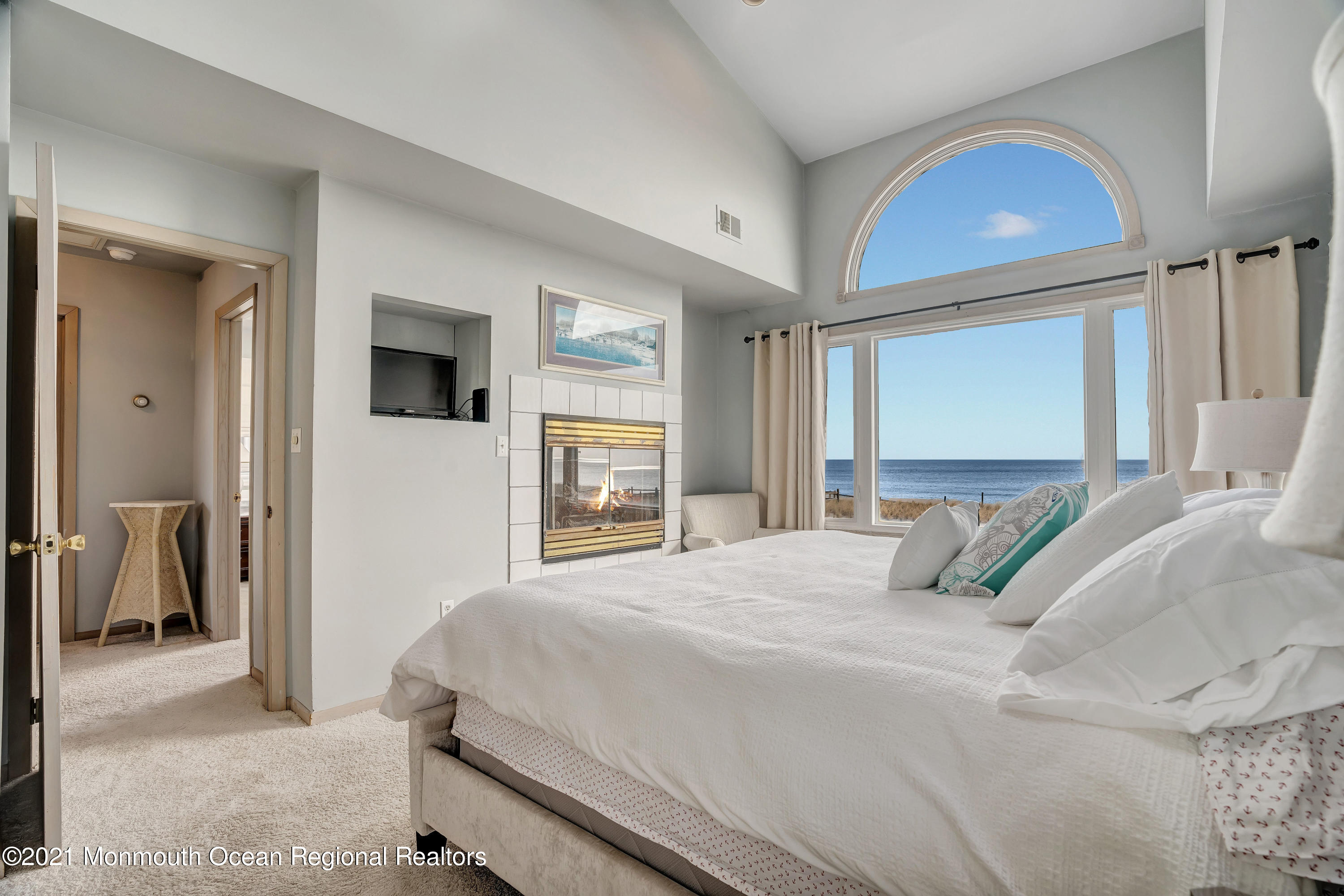 3176 Ocean Road Lavallette, NJ 08735 - Photo 33 of 39 a bedroom with a large bed and a window