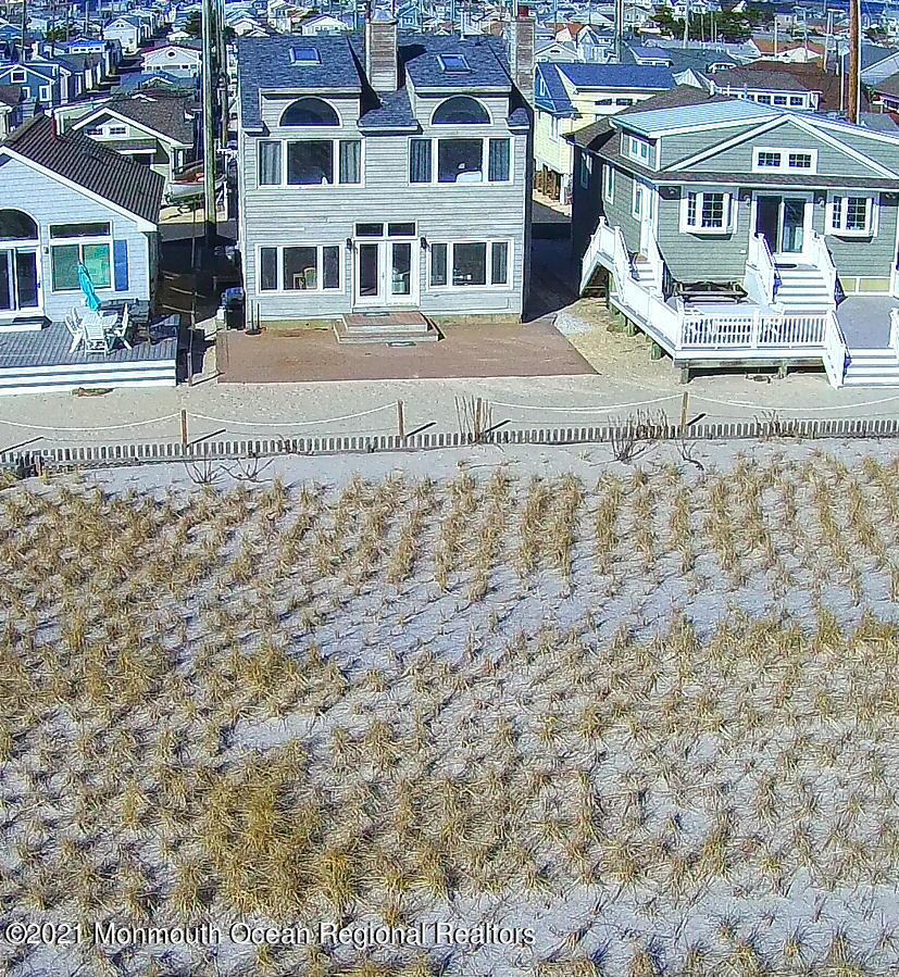 3176 Ocean Road Lavallette, NJ 08735 - Photo 10 of 39 a front view of a building with a garden