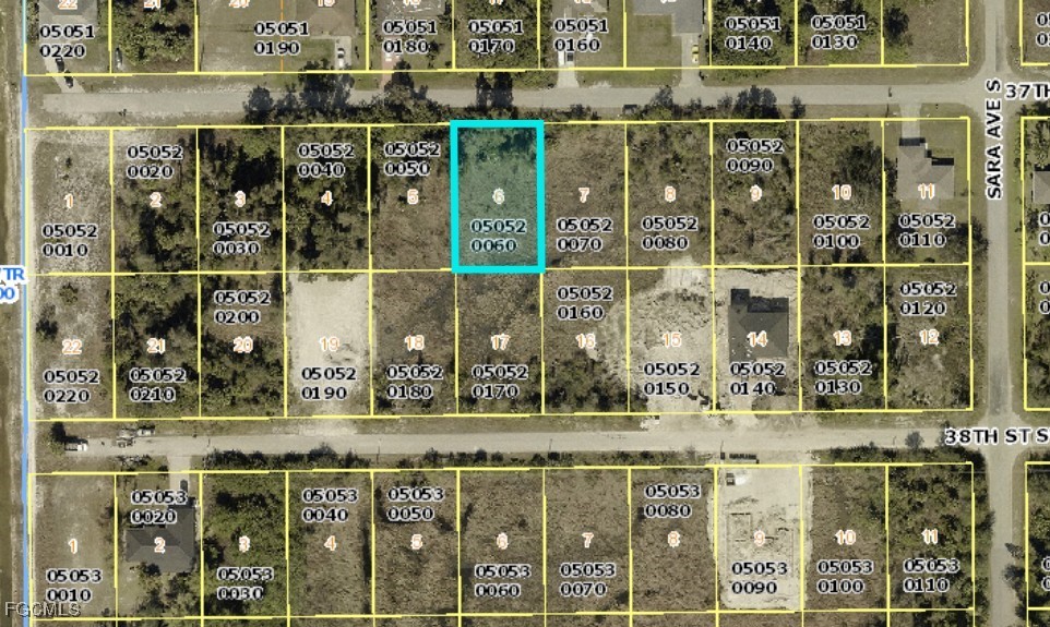 3411 37th Street Southwest Lehigh Acres, FL 33976 - Photo 1 of 1 a view of a street with a building