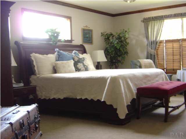 8855 Burning Tree Road Pensacola, FL 32514 - Photo 12 of 24 Spacious Owners suite, transom window provides great light.