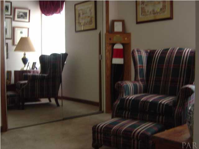 8855 Burning Tree Road Pensacola, FL 32514 - Photo 14 of 24 Separate sitting area for curling up with a good book. Extra mirrored closet here.