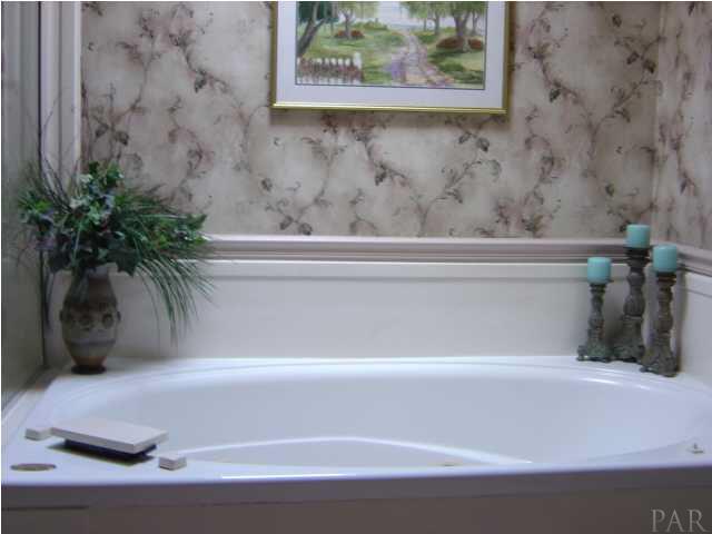 8855 Burning Tree Road Pensacola, FL 32514 - Photo 15 of 24 Sky light over the Jacuzzi whirlpool tub. Soak away the cares of the day.