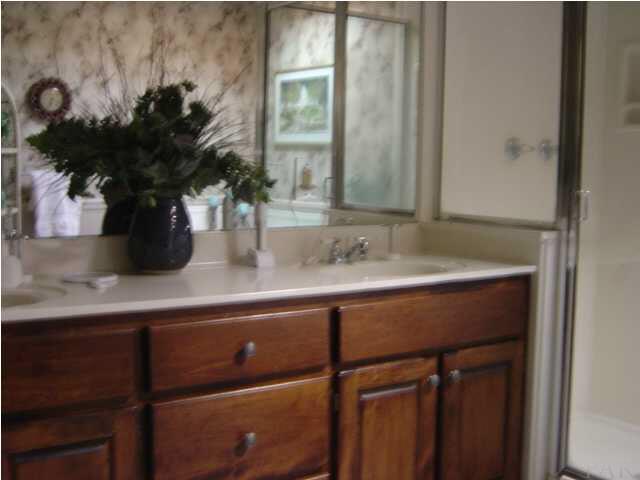 8855 Burning Tree Road Pensacola, FL 32514 - Photo 16 of 24 Separate corner shower. Vanity has his & hers sinks.