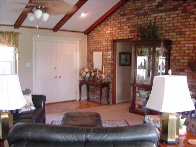 8855 Burning Tree Road Pensacola, FL 32514 - Photo 3 of 24 Brick accent wall & brick foyer floor.