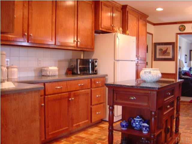 8855 Burning Tree Road Pensacola, FL 32514 - Photo 6 of 24 Warm kitchen with light cherry stained applewood cabinets.