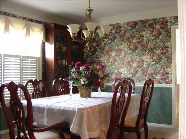 8855 Burning Tree Road Pensacola, FL 32514 - Photo 9 of 24 Formal dining made elegant, overlooking golf course.