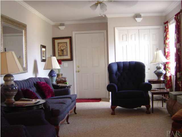 8855 Burning Tree Road Pensacola, FL 32514 - Photo 10 of 24 Family room with additional storage closet.