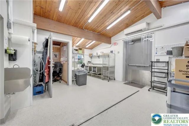 a view of a kitchen with refrigerator and stove