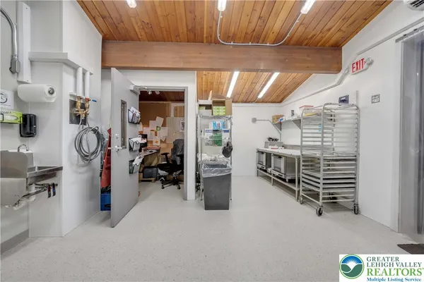 a view of a storage & utility room with racks