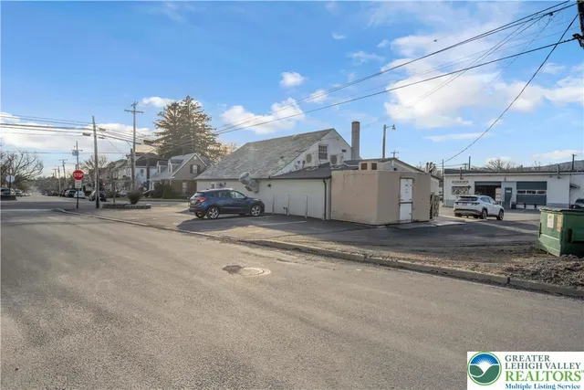 a view of a city street with a building