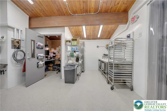 a front view of a house with a road