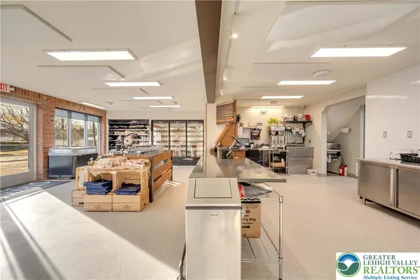 a kitchen with a stove and white cabinets