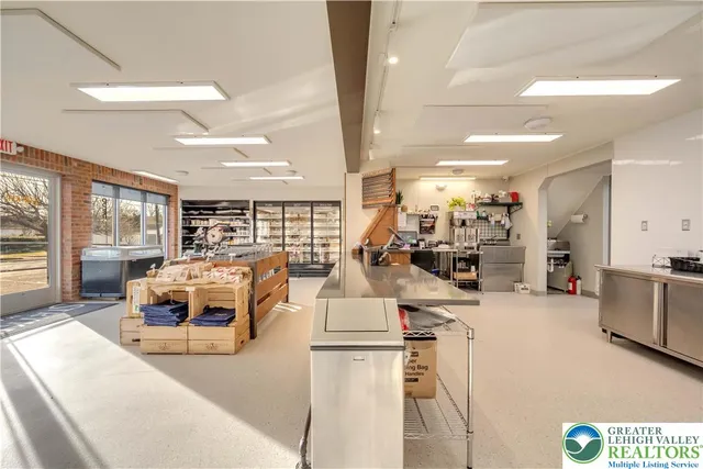 a kitchen with a stove and white cabinets