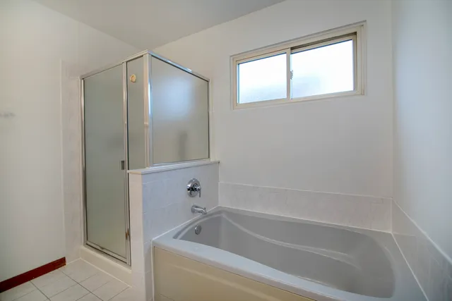 a bathroom with a bathtub a toilet and a sink