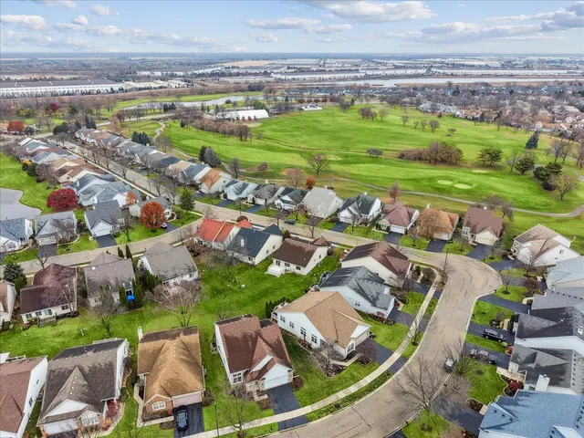 an aerial view of a yard and lake view
