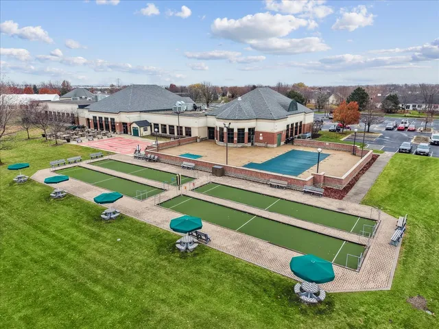 an aerial view of a house with swimming pool yard and outdoor seating