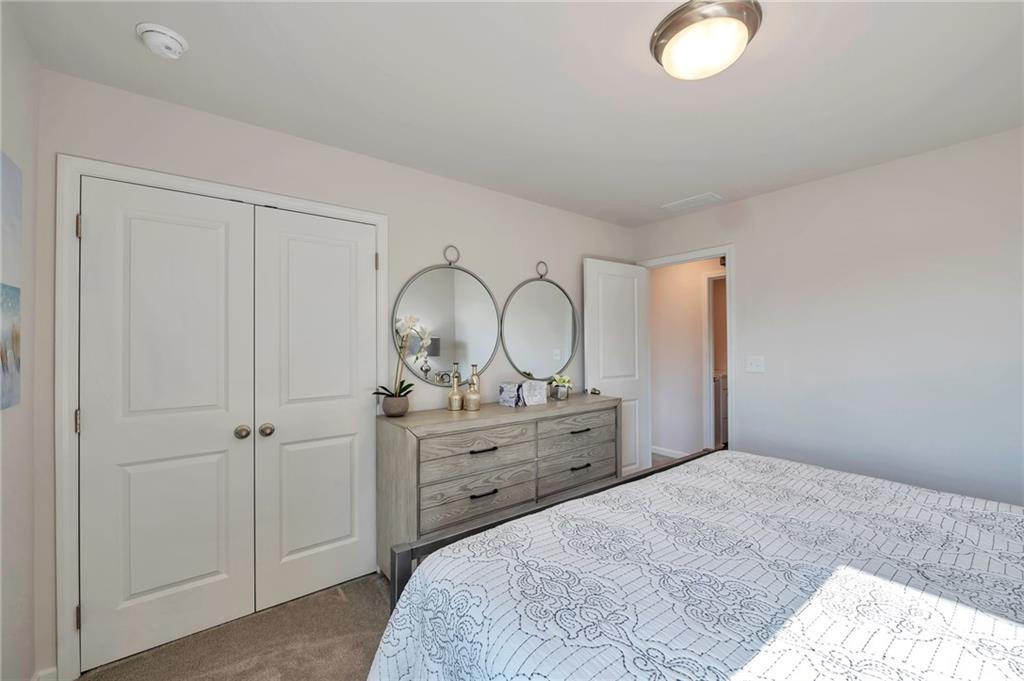 156 Millers Lane Calhoun, GA 30701 - Photo 23 of 26 a bedroom with a bed and a dresser