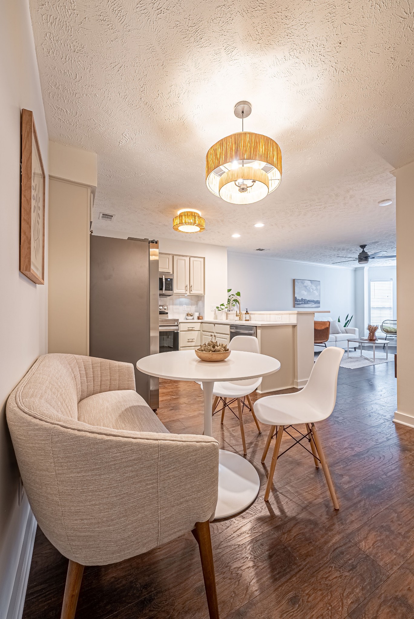 423 Compton Lane Franklin, TN 37069 - Photo 14 of 30 a living room with couches a dining table and chairs with wooden floor