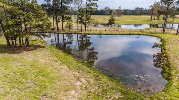 a view of a golf course with a lake