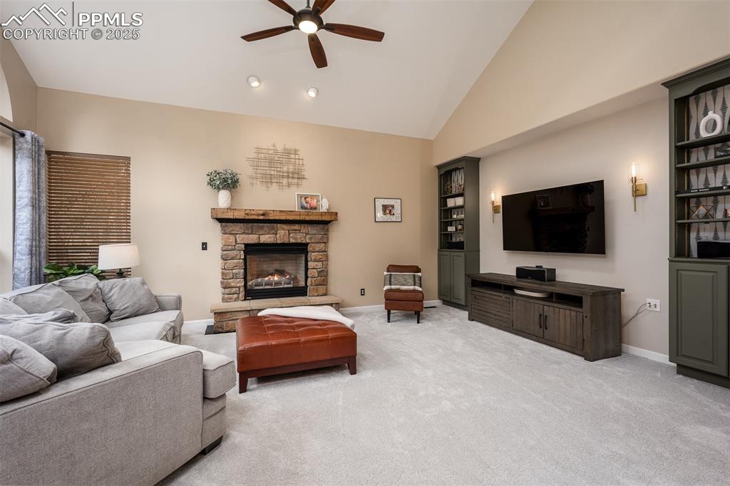 15580 Deercross Court Colorado Springs, CO 80921 - Photo 11 of 50 a living room with furniture and a flat screen tv