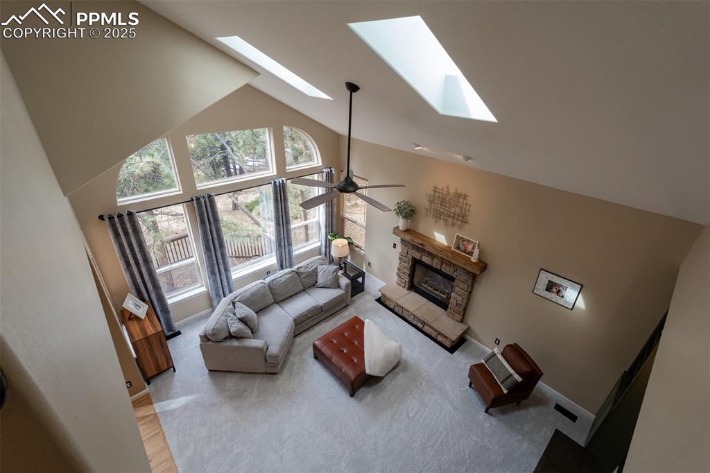 15580 Deercross Court Colorado Springs, CO 80921 - Photo 12 of 50 a living room with furniture and a large window