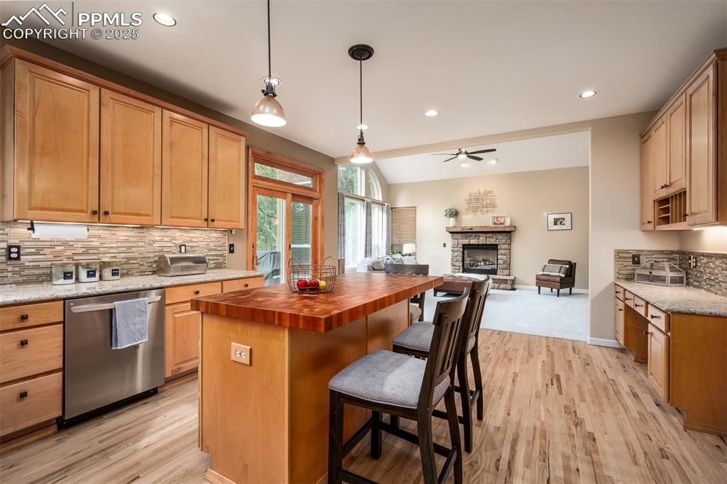 15580 Deercross Court Colorado Springs, CO 80921 - Photo 20 of 50 a kitchen with stainless steel appliances granite countertop counter space a sink and cabinets