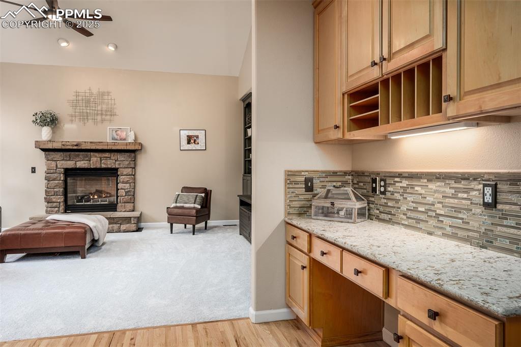 15580 Deercross Court Colorado Springs, CO 80921 - Photo 21 of 50 a kitchen with stainless steel appliances granite countertop a stove and a sink with granite countertops