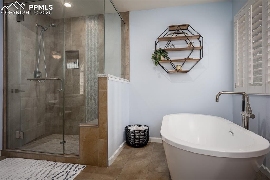 15580 Deercross Court Colorado Springs, CO 80921 - Photo 33 of 50 a bathroom with a toilet a sink and shower