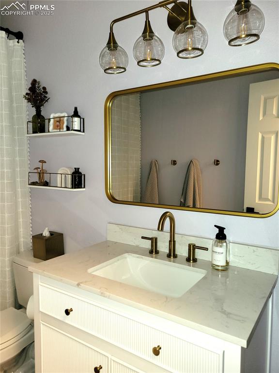 15580 Deercross Court Colorado Springs, CO 80921 - Photo 39 of 50 a bathroom with a sink and a mirror