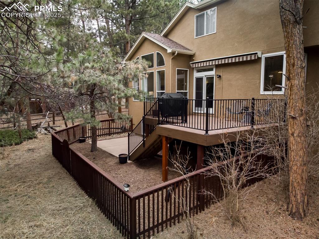 15580 Deercross Court Colorado Springs, CO 80921 - Photo 47 of 50 a roof deck with table and chairs