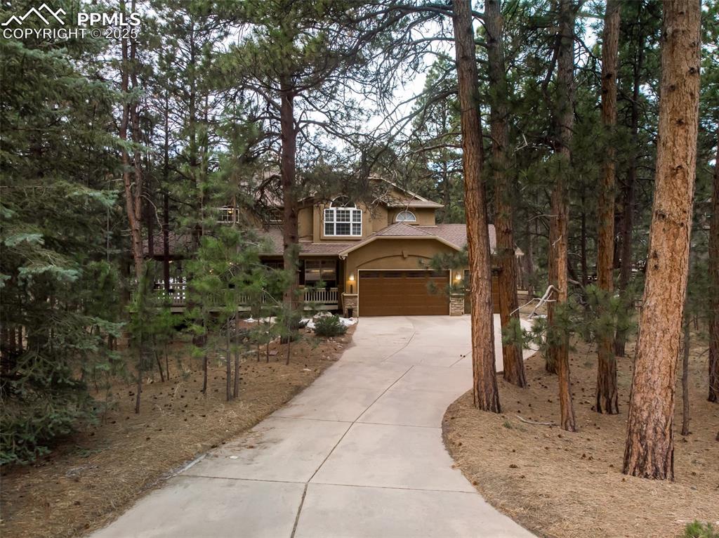 15580 Deercross Court Colorado Springs, CO 80921 - Photo 6 of 50 Front of home with a 3 car garage