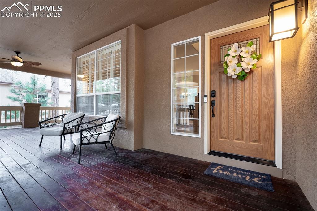 15580 Deercross Court Colorado Springs, CO 80921 - Photo 8 of 50 a dining room with furniture a rug and wooden floor