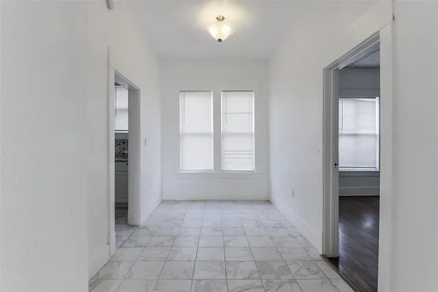 a view of an empty room and window