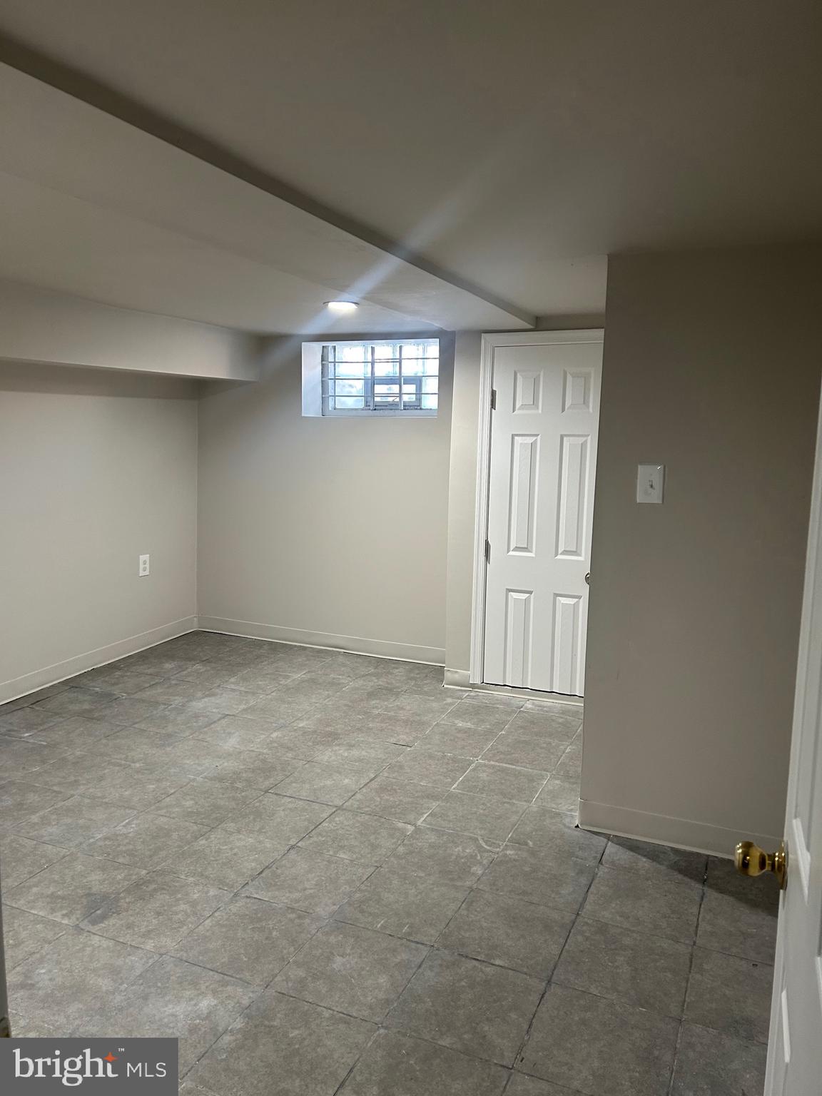 2111 Eagle Street Baltimore, MD 21223 - Photo 10 of 16 an empty room with windows