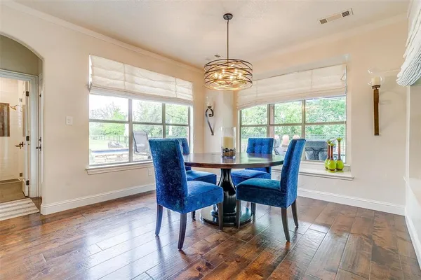 a view of a dining room with furniture window and outside view