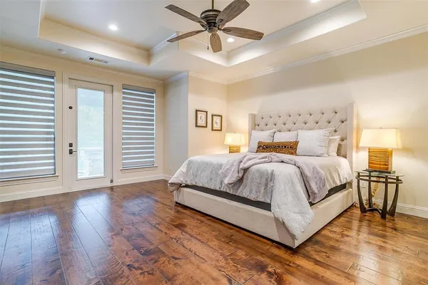 a spacious bedroom with a bed and window