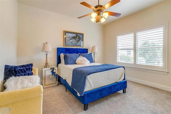 a bedroom with a large bed and a couch