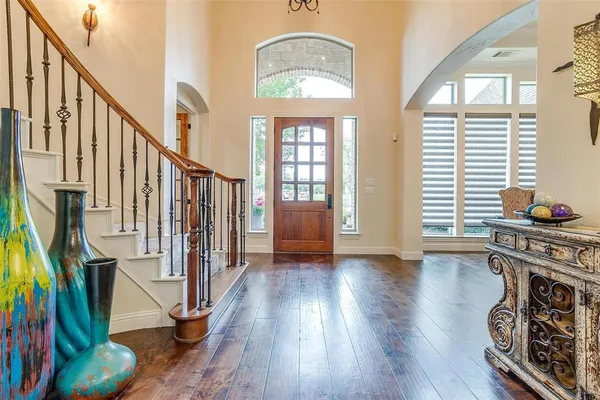 a view of an entryway with wooden floor