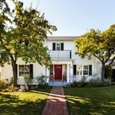 a front view of house with yard and green space