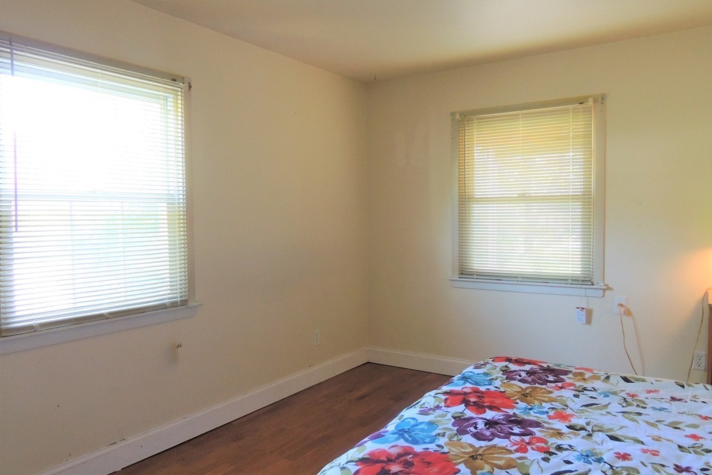 20 Keddy Street Springfield, MA 01109 - Photo 14 of 17 a bedroom with a bed and a window