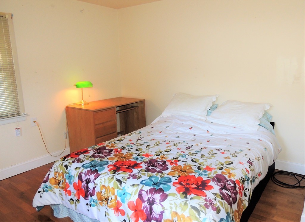 20 Keddy Street Springfield, MA 01109 - Photo 15 of 17 a bedroom with a bed and a dresser