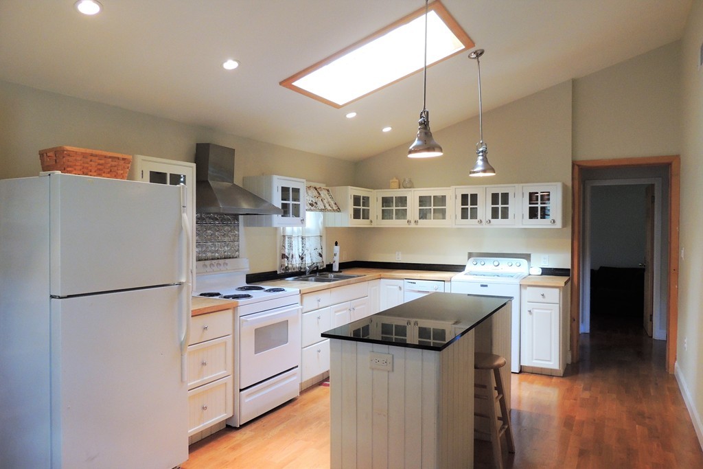20 Keddy Street Springfield, MA 01109 - Photo 3 of 17 a kitchen with a stove a refrigerator and a sink