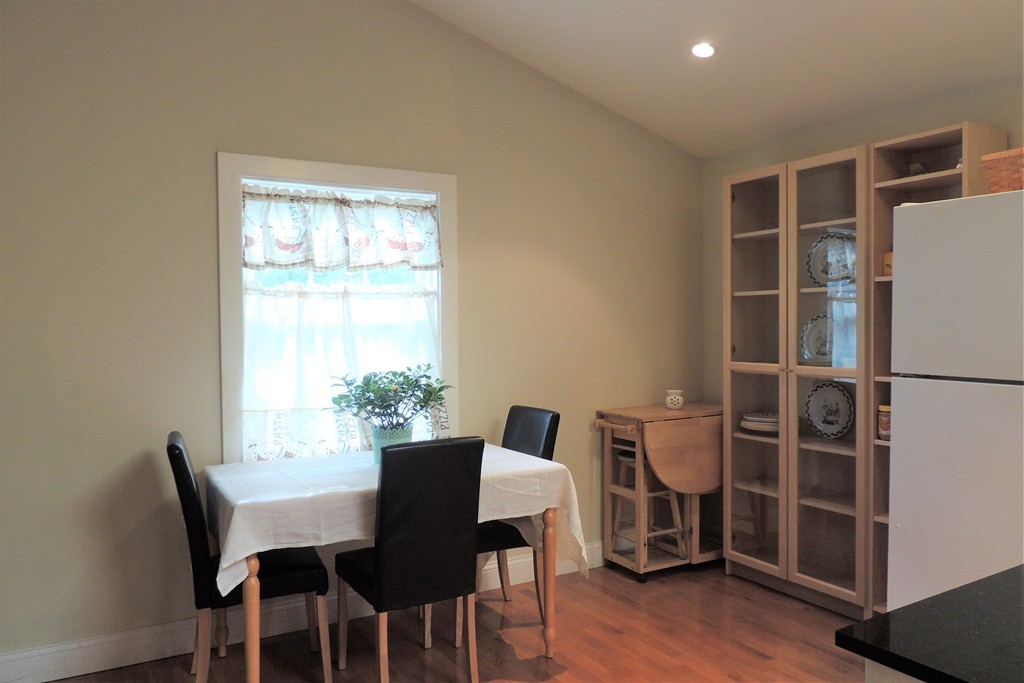 20 Keddy Street Springfield, MA 01109 - Photo 6 of 17 a view of a dining room with furniture and wooden floor