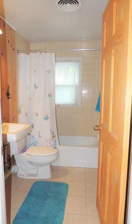 20 Keddy Street Springfield, MA 01109 - Photo 9 of 17 a bath room with a toilet a bath tub and a shower