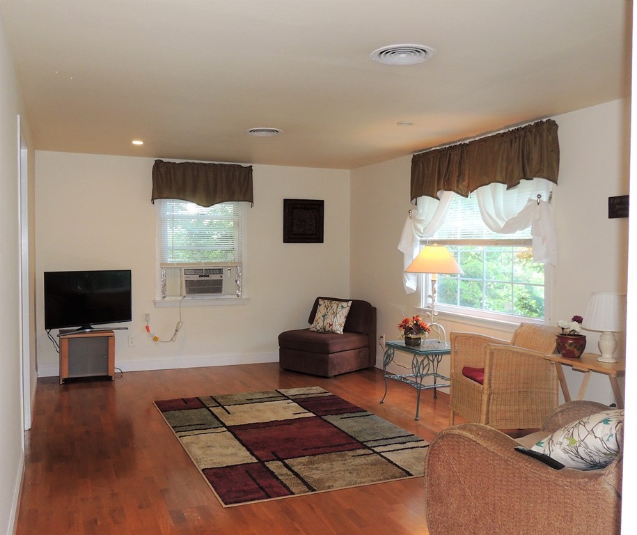 20 Keddy Street Springfield, MA 01109 - Photo 10 of 17 a living room with furniture and a flat screen tv