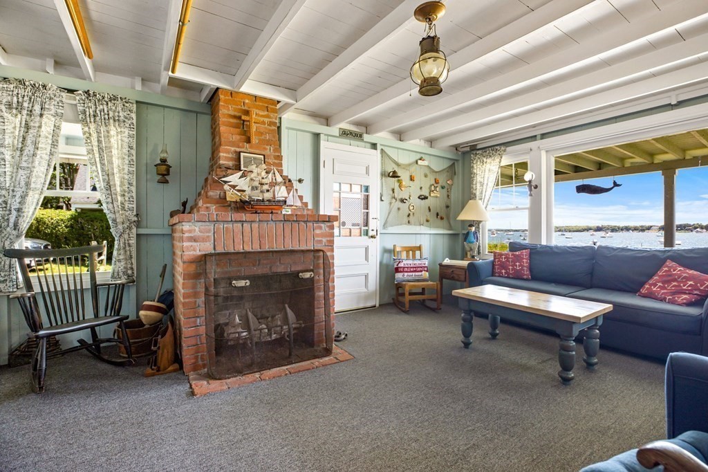 7 Pequod Lane Wareham, MA 02532 - Photo 12 of 26 a living room with furniture and a fireplace