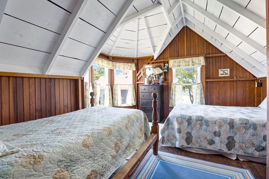 7 Pequod Lane Wareham, MA 02532 - Photo 14 of 26 a bedroom with a bed a dresser and a large window